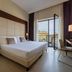 iH Hotels Milano Watt 13 room with king bed, desk and balcony door in Milan