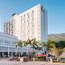 Marriott Port-au-Prince Hotel in Port Au Prince with outdoor terrace, palm trees and mountain views