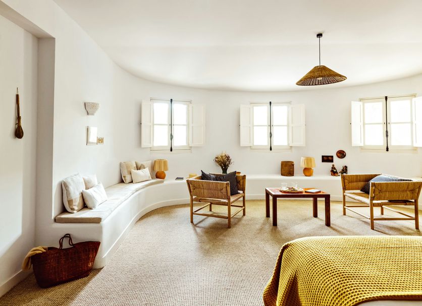 Le Moulin, Lourmarin, a Beaumier Hotel lounge with curved seating, wicker chairs and bright windows