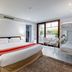 Hotel Rio Bidasoa room in Hondarribia with king bed, balcony seating and bunk beds