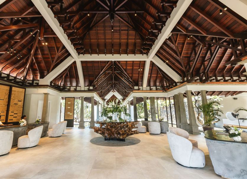 Maradiva Villas Resort & Spa lobby in Flic en Flac with vaulted wood roof and circular seating area