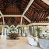 Maradiva Villas Resort & Spa lobby in Flic en Flac with vaulted wood roof and circular seating area