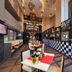 Swiss-Belhotel Mangga Besar in Jakarta shows a stylish checkered café counter and dining area.