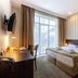 Citrus Hotel Tbilisi guest room with double bed, desk, balcony doors and large window
