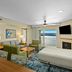 WorldMark Lake of the Ozarks in Osage Beach: lake-view hotel room with balcony, sofa, chairs and kitchenette