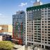 DoubleTree by Hilton Long Island City New York hotel exterior in Queens with city skyline views