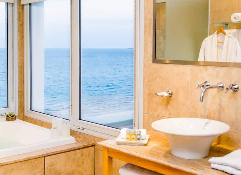 Hotel Península Valdés bathroom with soaking tub and ocean view in Puerto Madryn