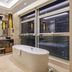 Pearl River Garden Hotel Changsha bathroom with freestanding tub and floor-to-ceiling city views