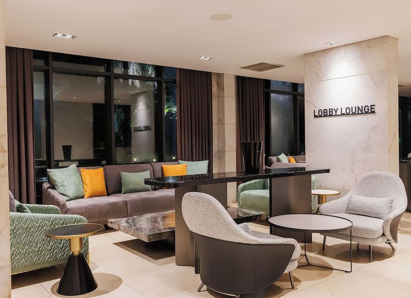Riviera Royal Hotel in Conakry lobby lounge with sofas, armchairs and round tables