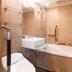 Apa Hotel Kanda Ekimae bathroom in Tokyo with bathtub, sink, grab bars and shower