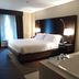 Holiday Inn Express & Suites Waterford guest room with king bed and soaking tub