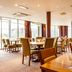 Premier Inn Nottingham Arena - London Road restaurant dining area with large windows and city views in Nottingham