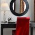 El Primero Hotel, Chula Vista: guest room desk with red chair, lamp, round mirror and patterned curtains