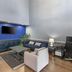 SureStay Plus by Best Western Asheboro lounge with TV, sofas, coffee table and workspace