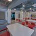 City Express Junior by Marriott Guadalajara Periférico Sur breakfast room with red chairs and dining tables