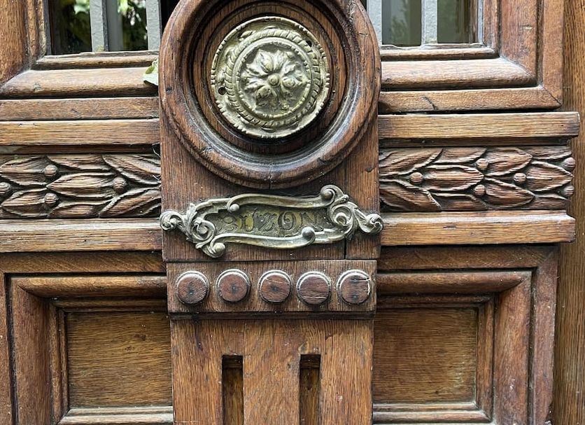 Le Petit Palais Buenos Aires carved wooden door with ornate decorative metal details