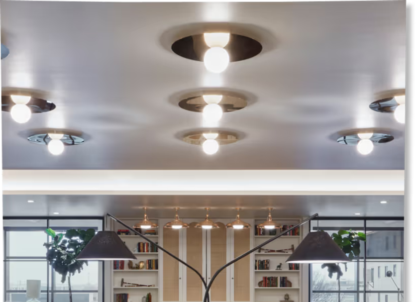 Citizen House Oklahoma City lobby seating area with modern lamps, shelves, and glass partitions