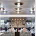 Citizen House Oklahoma City lobby seating area with modern lamps, shelves, and glass partitions