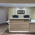 TownePlace Suites by Marriott Naples lobby reception desk with computer stations and flowers