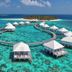 Diamonds Thudufushi Beach & Water Villas overwater villas on turquoise lagoon in Thudufushi