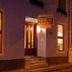 Pousada da Sesmaria in São Sebastião, nighttime exterior with lit entrance and windows