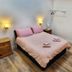 Deepcut Lodge Bed & Breakfast Self Service room in Camberley with double bed and bedside lamps