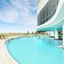 Hyatt Place Panama City Beach/Beachfront pool deck with curved outdoor pool and Gulf view
