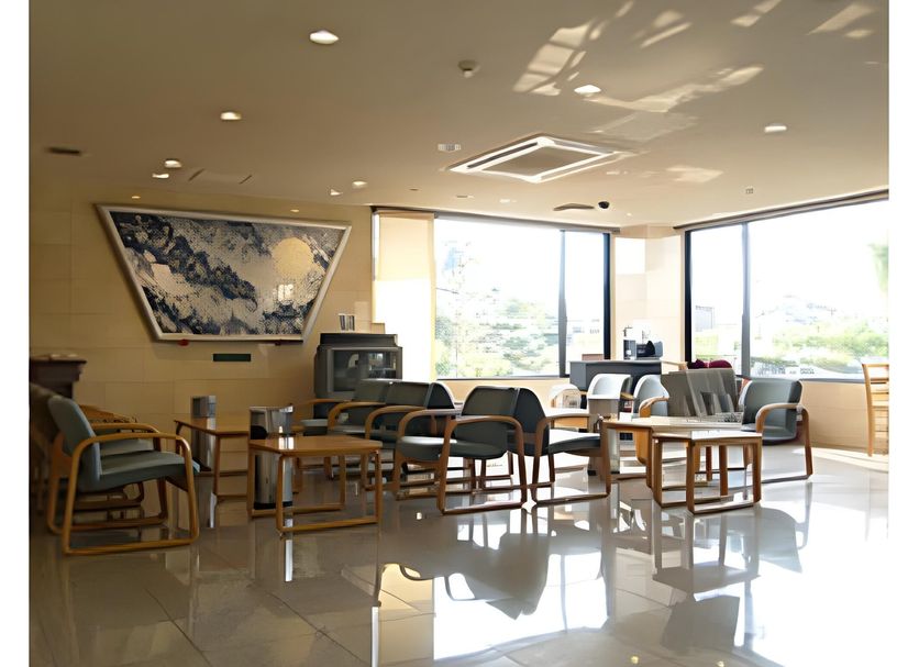 Hotel Shin-ei in Toyota lobby lounge with seating and large windows
