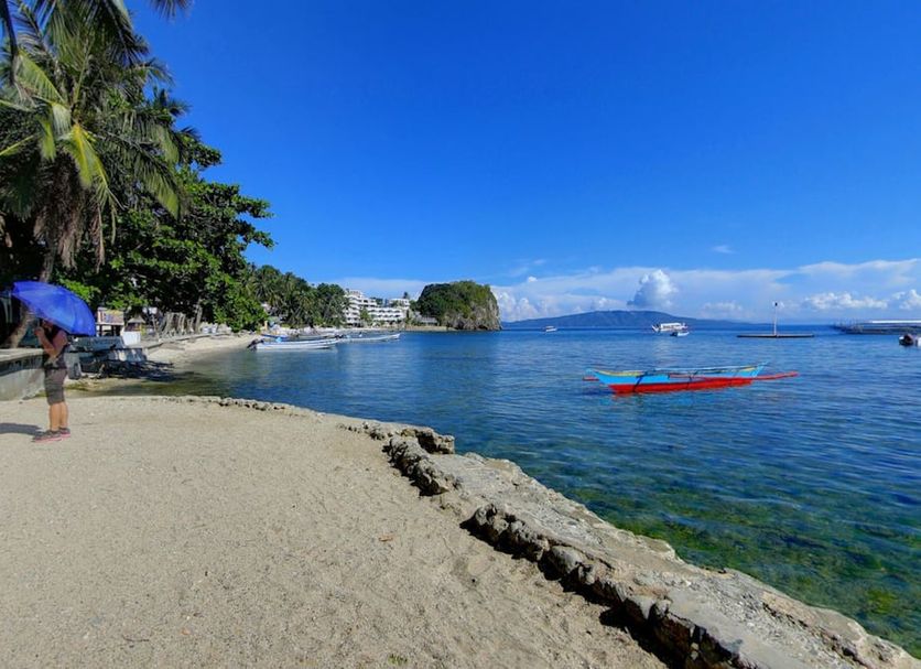 El Galleon Beach Resort in Puerto Galera with sandy beach, clear water, and bay views