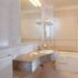 Ca Rialto House Venice bathroom with bathtub, sink, and large mirror
