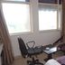 Hotel Airport Centre Point Nagpur room with desk, chair, sofa, and window light