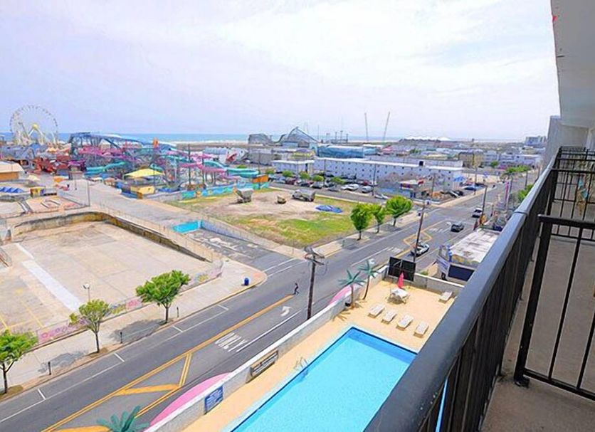 Beach Terrace Motor Inn, Wildwood balcony view of pool, boardwalk rides and ocean