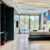 Chalay Monta Hua Hin guest room with bed, floor-to-ceiling windows, and sliding glass doors