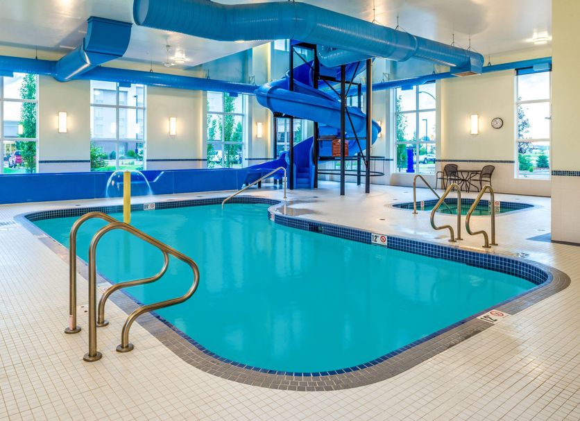 Microtel Inn & Suites by Wyndham Red Deer indoor pool with waterslide and hot tub