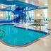 Microtel Inn & Suites by Wyndham Red Deer indoor pool with waterslide and hot tub