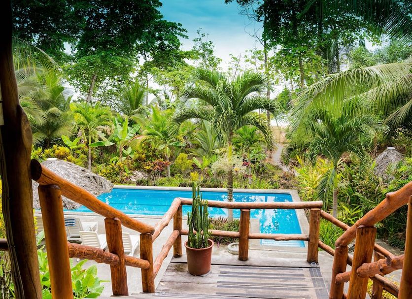 Bluff Beach Retreat in Bocas del Toro with tropical garden, wooden deck, and outdoor pool view