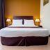 Orkid Inn Mahkota Cheras Kuala Lumpur guest room with double bed, bedside lamps and window view