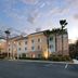 Fairfield Inn & Suites by Marriott St. Augustine I-95 exterior with palm trees and parking lot