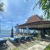 Bali Santi Bungalows in Manggis: oceanfront poolside loungers and thatched beach bar with sea view