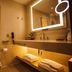 Lavande Hotel Yichang Baota River Wanda bathroom with illuminated mirror, sink, and toilet in Yichang