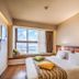Nof Hotel in Haifa room with bed, window seat, and city-and-sea view