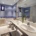 Bathroom at Parador de Jarandilla de la Vera in Jarandilla de la Vera with twin sinks and tiled walls