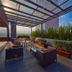 Hilton Garden Inn Mexico City Polanco rooftop terrace with lounge seating and city views