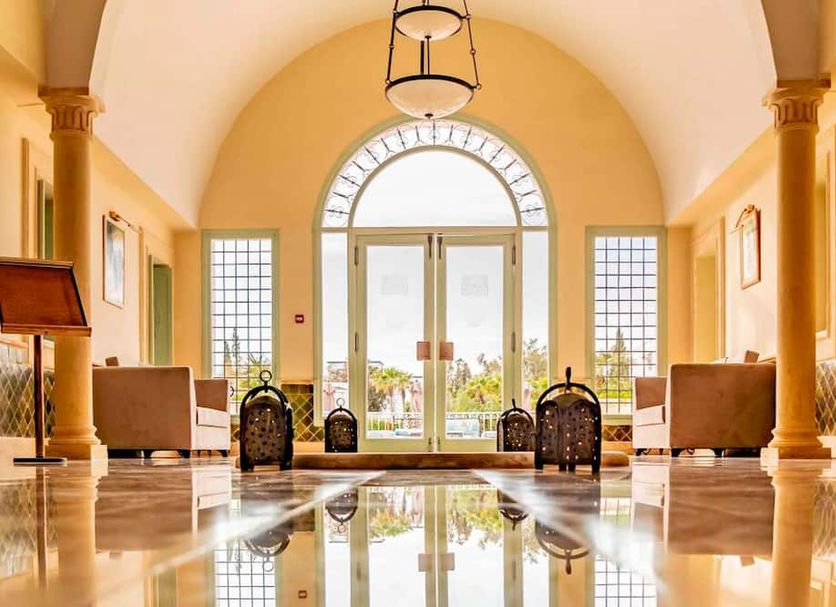 TMK Flora Park by Turismark in Hammamet: elegant lobby with arched ceiling, columns and glass doors