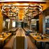 Hideaway at Royalton Punta Cana restaurant with long banquet tables and chandeliers