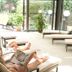 Das Lafairs in Pfunds: guests relaxing on lounge chairs in a sunlit spa area with garden views