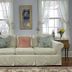 Lightner Farmhouse B&B in Gettysburg: elegant sitting room with white sofa, windows, and floral accents