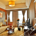 New Century Hotel Pudong Shanghai suite with sofa, desk, and large window in Shanghai