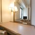 Nara Washington Hotel Plaza desk with lamp, mirror and TV in a guest room, Nara