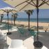 Hotel Agaró in Chipiona: oceanfront terrace with umbrellas, tables, lounge chairs and sea views